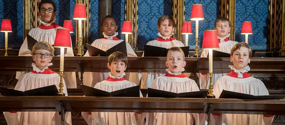 A group of children singing Christmas Carols as a part of the First Eucharist of Christmas night at the Westminster Abbey